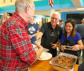 Vice President Mike Pence and his wife, Karen, helped prepare and serve Thanksgiving lunch in Englewood, Florida.
