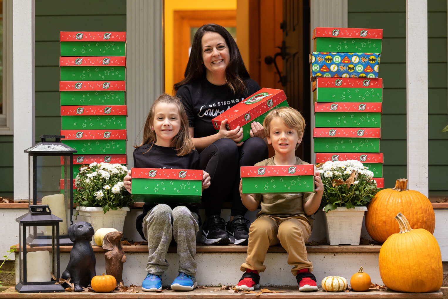 Ava Smith, left, has encouraged her family to pack shoeboxes for children in need all over the world.