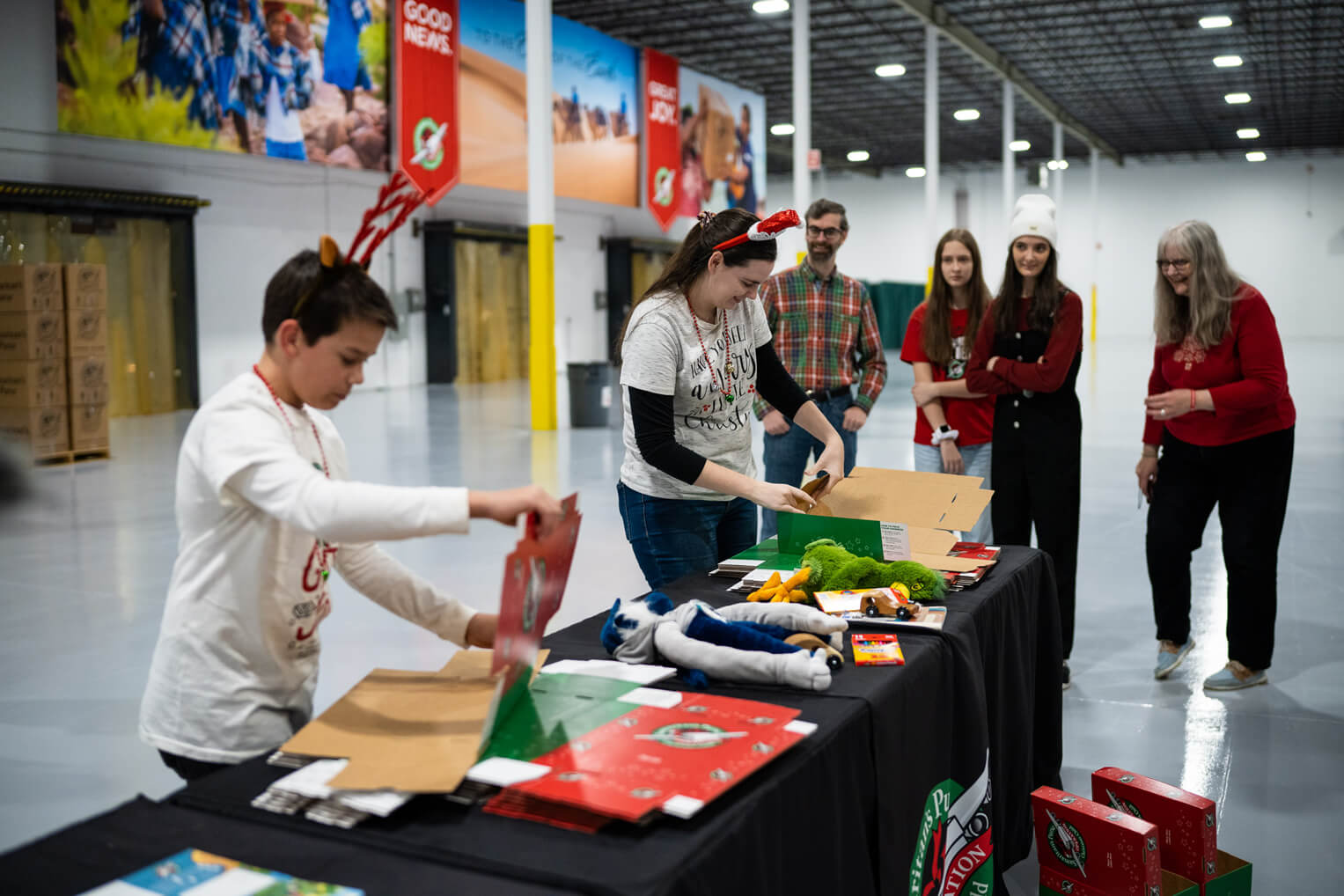 Volunteers enjoy a shoebox packing race during National Collection Week in Chicago.