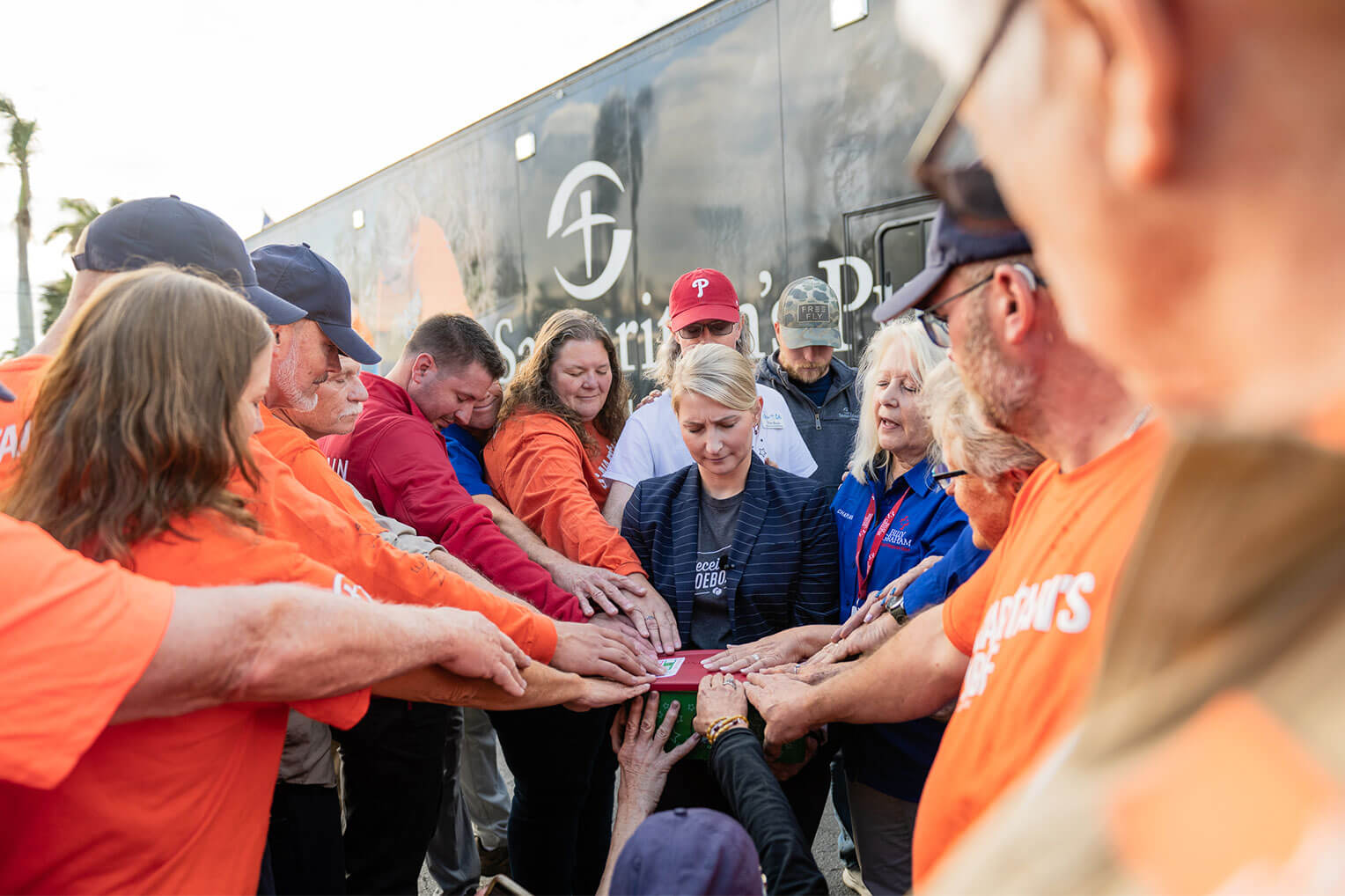 Samaritan's Purse U.S.  Disaster Relief volunteers and Billy Graham Rapid Response Team chaplains pray with Elizabeth Groff for the 200 millionth shoebox collected by Operation Christmas Child since 1993. 