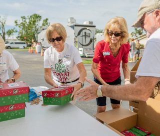 Residents and church members drop off shoebox gifts in Punta Gorda, Florida.