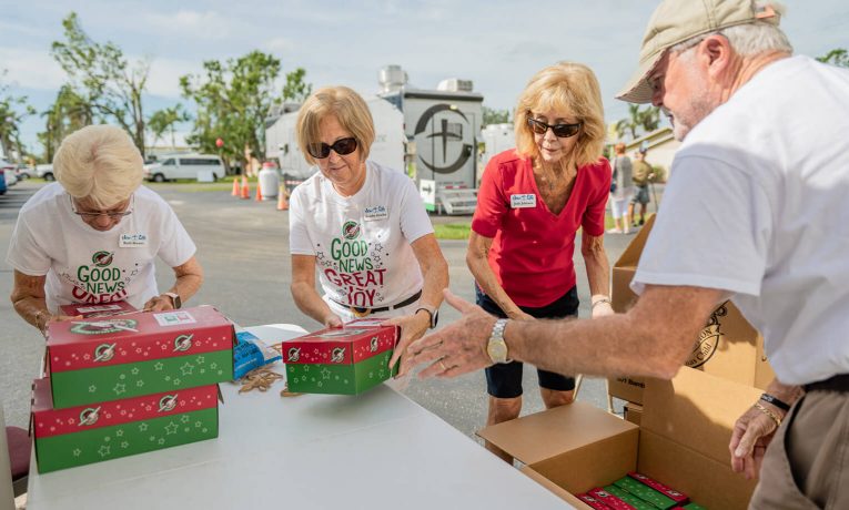 Residents and church members drop off shoebox gifts in Punta Gorda, Florida.