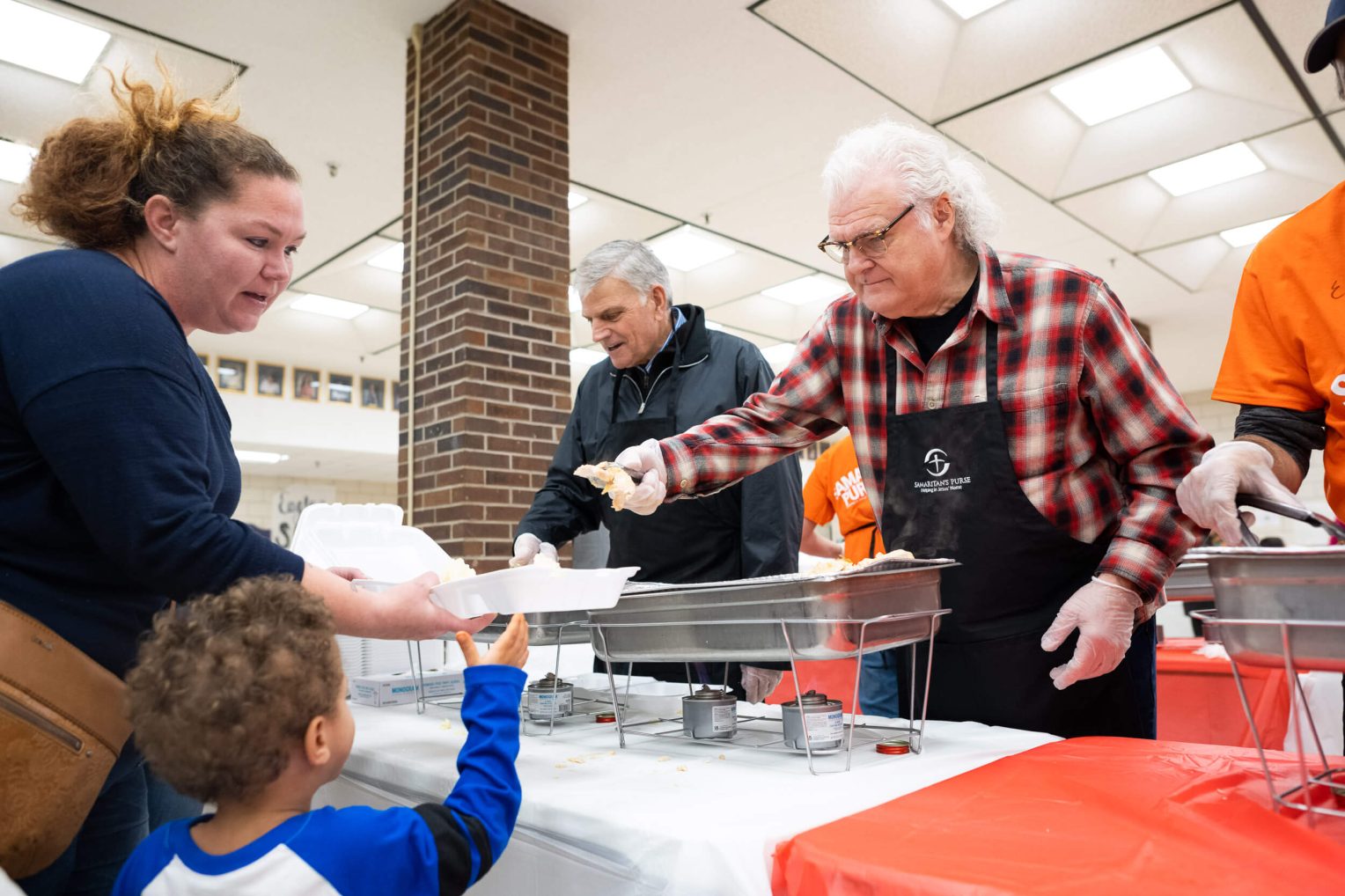 Ricky Skaggs and Franklin Graham served meals on Christmas Eve 2021 in Mayfield.