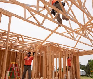 Samaritan's Purse volunteers work on a new house in Mayfield.