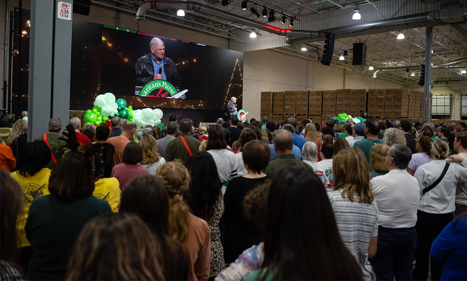 Franklin Graham addresses Samaritan's Purse staff and volunteers at the Charlotte Processing Center.