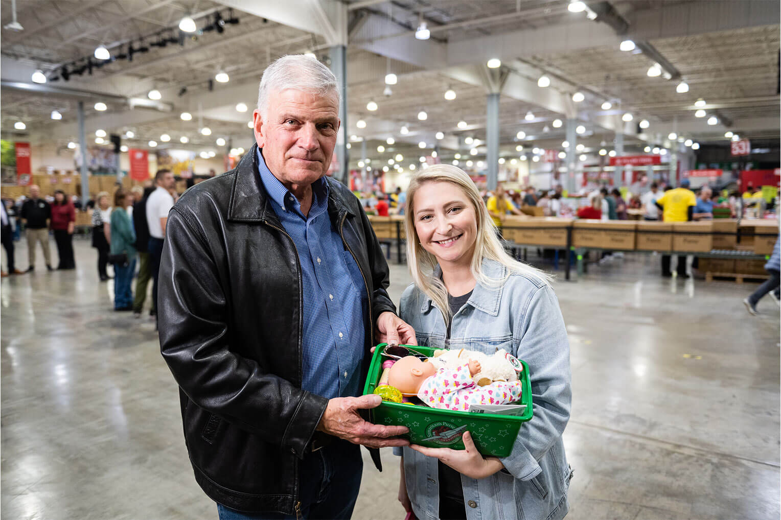 Franklin Graham and Elizabeth Groff in Charlotte with the symbolic 200 millionth shoebox gift.