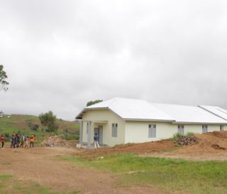 Members of the Evangelical Assembly of Sorodo enter their new building.