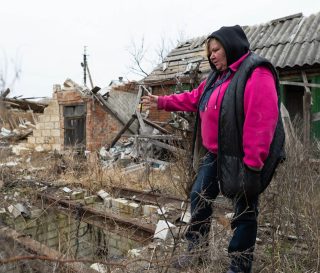 Olga surveys the ruins of her property in far eastern