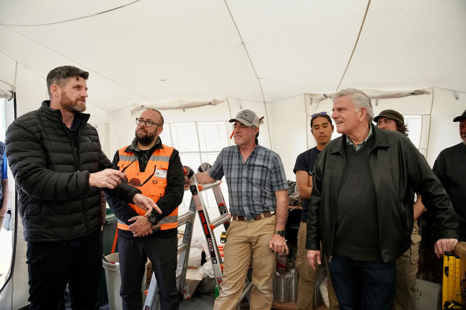 Franklin Graham and son, Edward,  met with the build team and with other disaster specialists as further modifications were made to the field hospital.