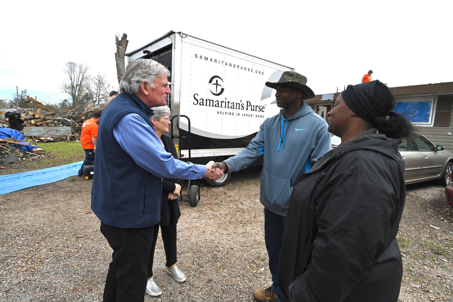 Franklin Graham encouraged Rolling Fork homeowners Andre Brown and Mary Rockingham.