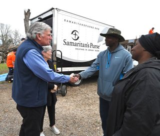 Franklin Graham encouraged Rolling Fork homeowners Andre Brown and Mary Rockingham.