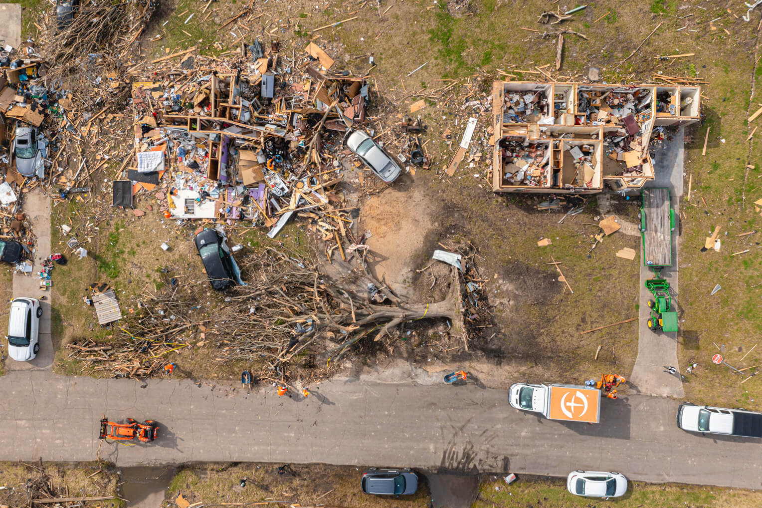 Aerial shot of tornado destruction. Homes flattened.