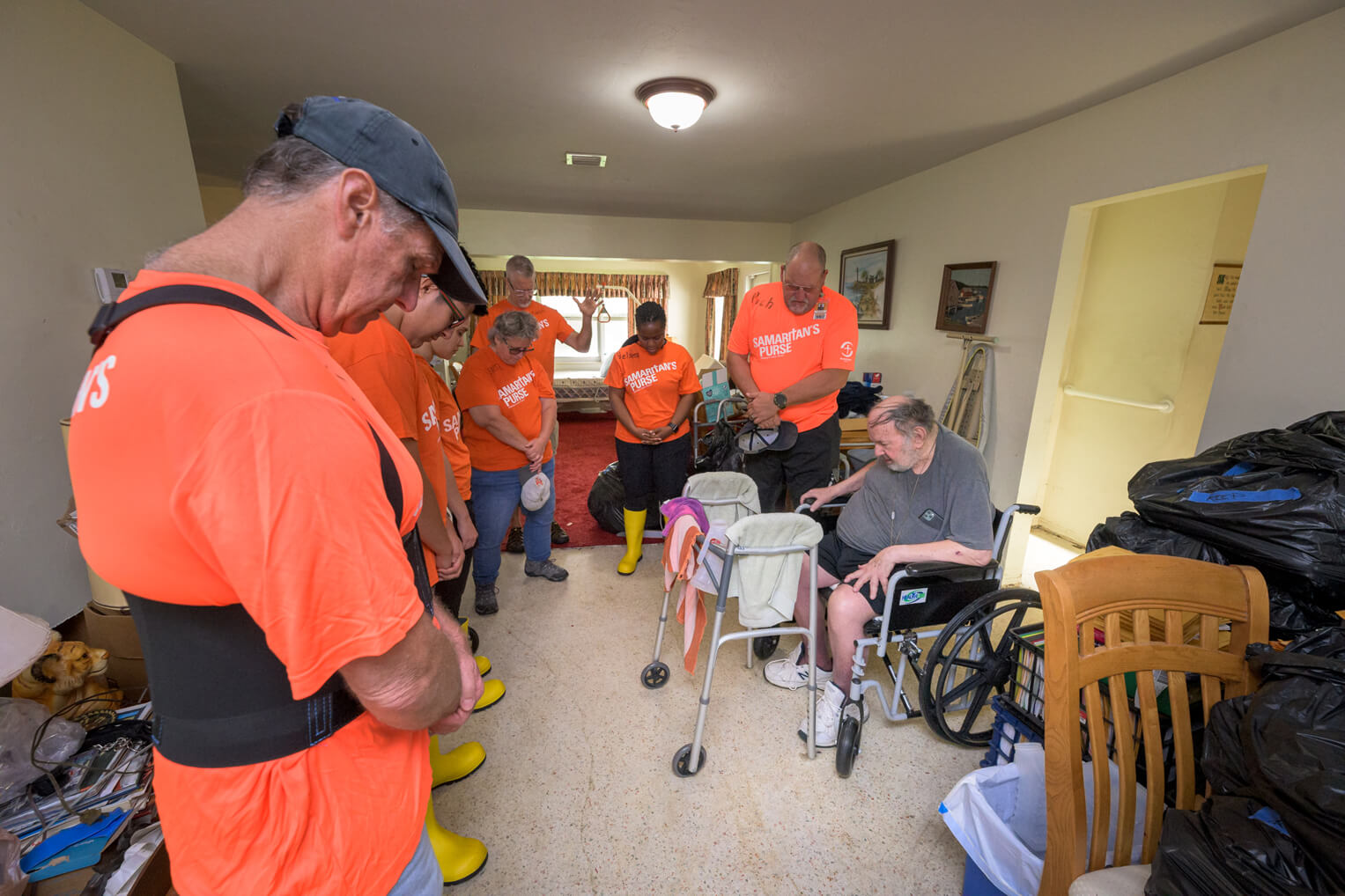 Samaritan's Purse volunteers took the time to pray with Paul as they cleaned out his home.