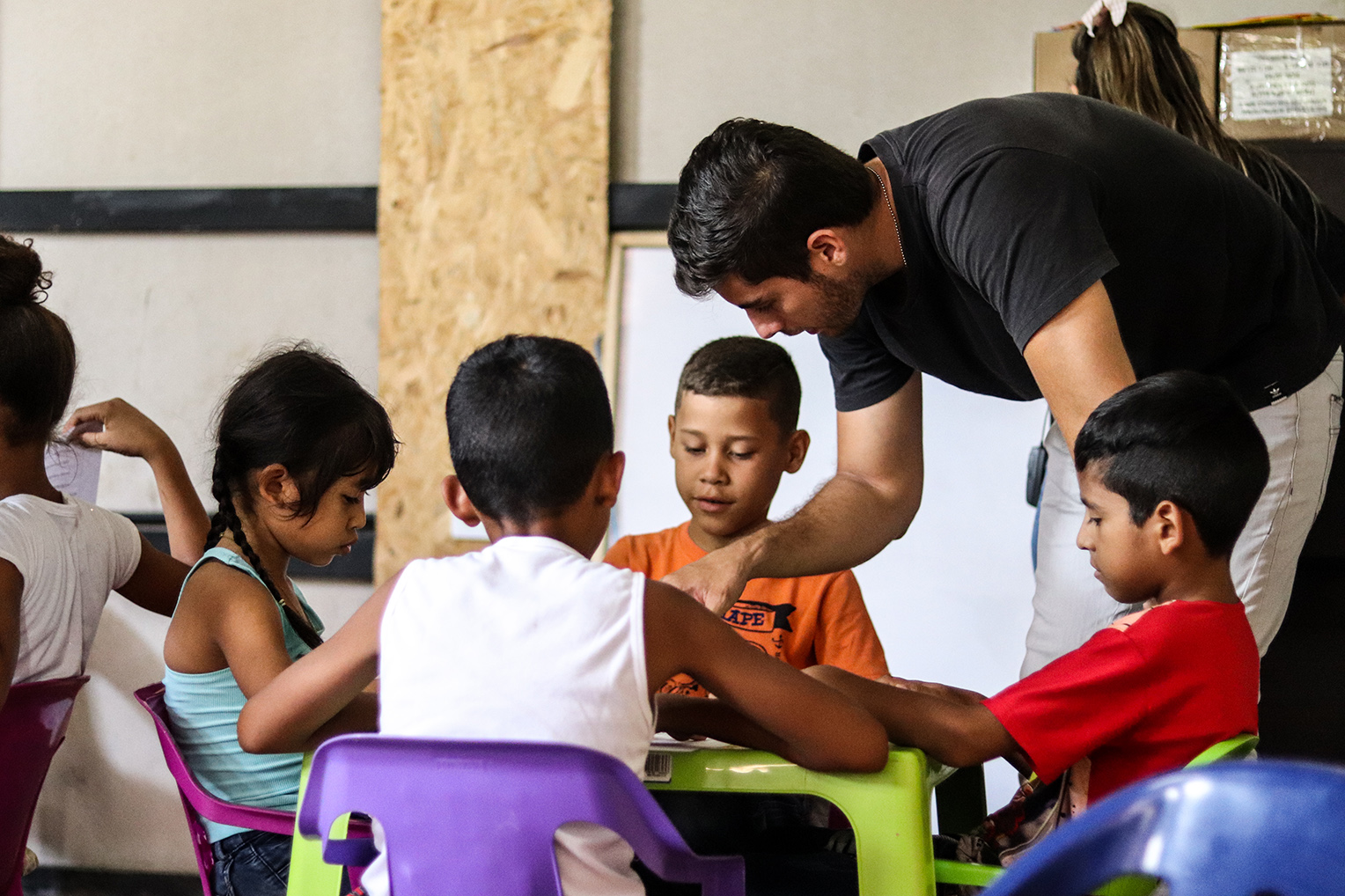 Samaritan’s Purse team members help the children understand Bible lessons and how to apply them to their lives.