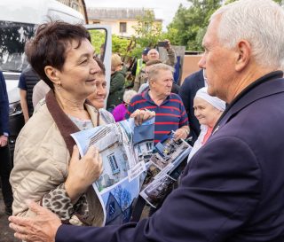 Mike Pence meets with residents outside Kyiv.
