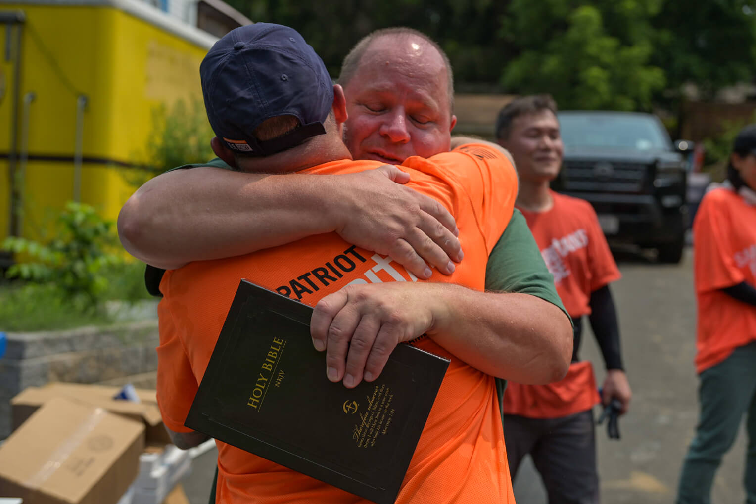 Homeowner Joe Bartel received a special Billy Graham Study Bible with signatures from each volunteer. He was overcome with gratitude for the work on his home.