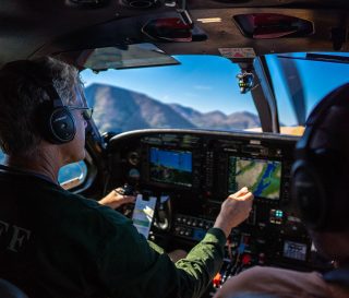 Samaritan's Purse Pilot and Guide Bill Sims, a lifelong aviator in Alaska, flies couples through the wilderness of Lake Clark National Park.