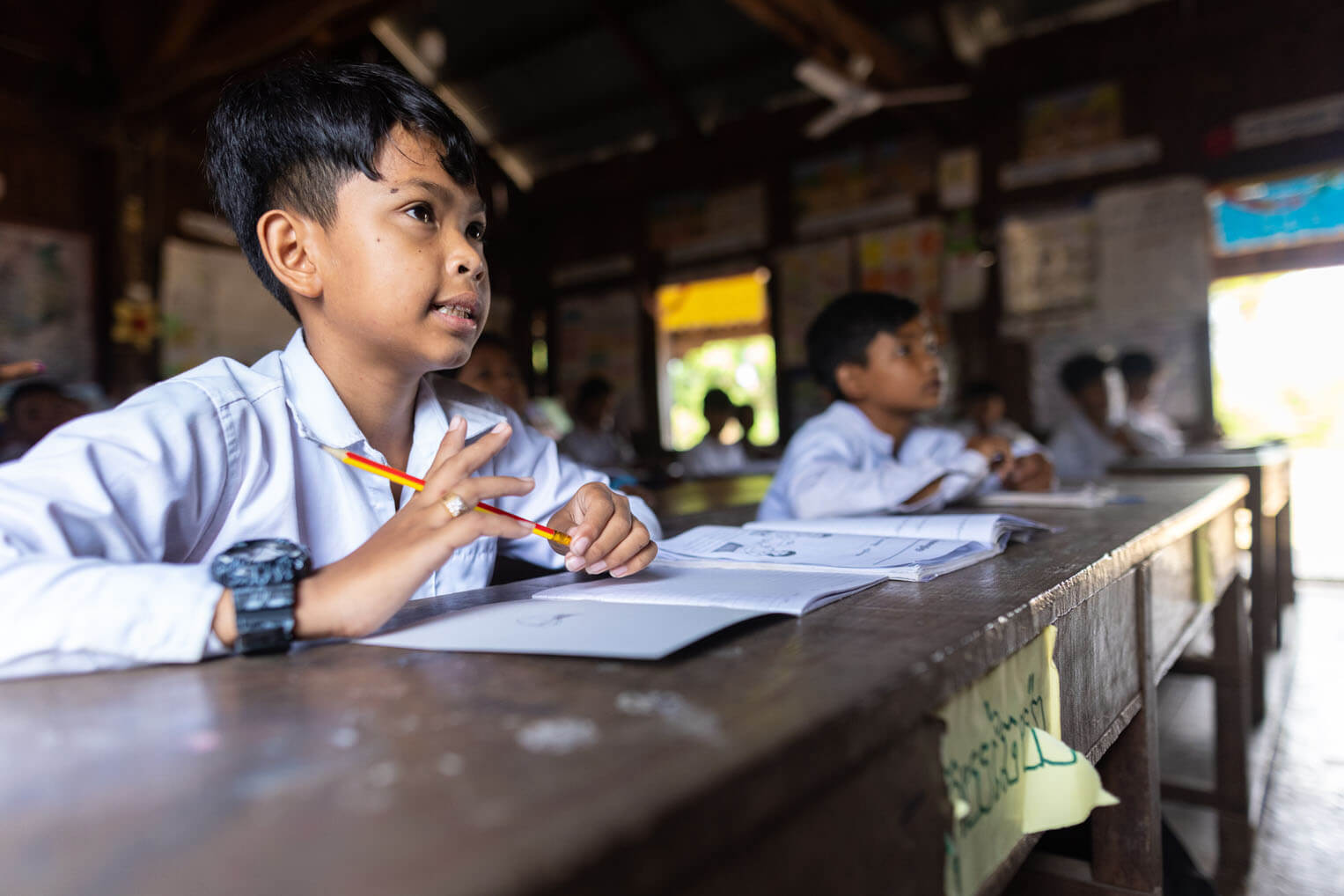 Students in Kimthon's school attend class in an older building. Soon, they will receive a brand new school that is being constructed by Samaritan's Purse. 