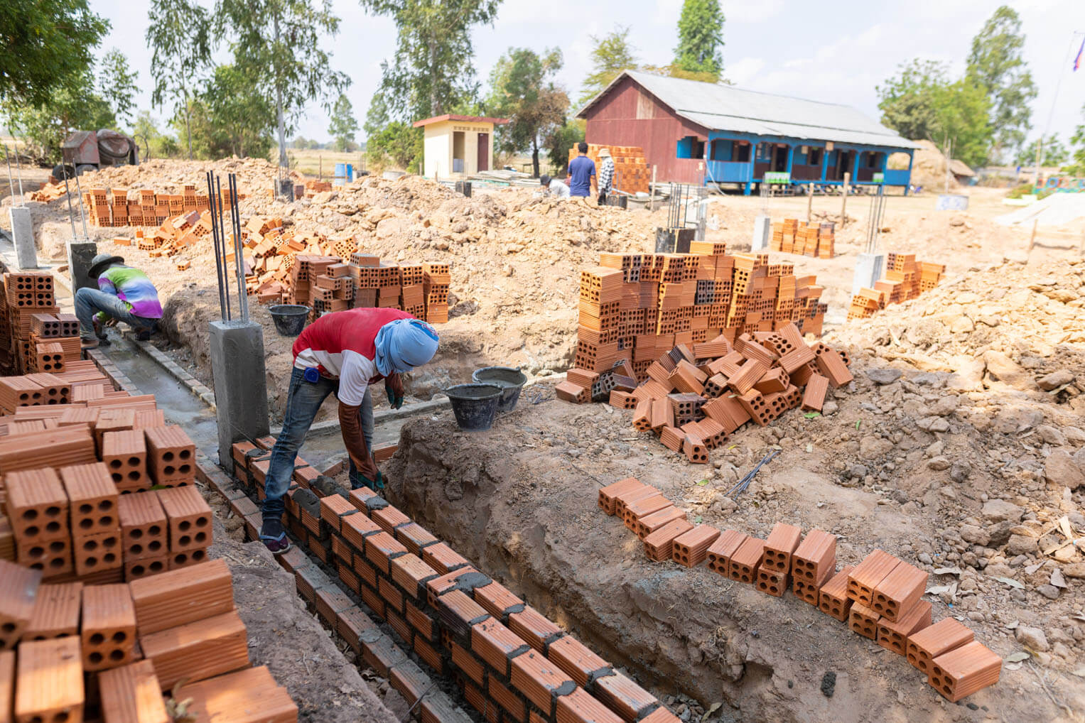 A new and improved elementary school is being built for the children in a rural village in Cambodia. 