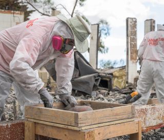 Volunteers sift through properties on Maui after wildfires destroyed many homes across the island.