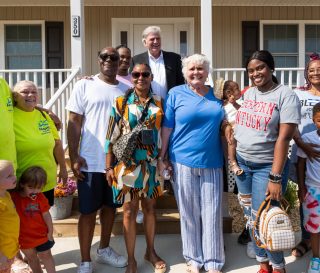 Franklin Graham stands with new homeowners in Mayfield, Kentucky.