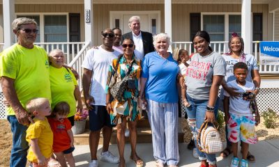Franklin Graham stands with new homeowners in Mayfield, Kentucky.