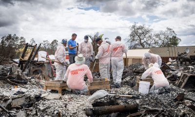 Samaritan’s Purse volunteers sift through ashes after a wildfire.