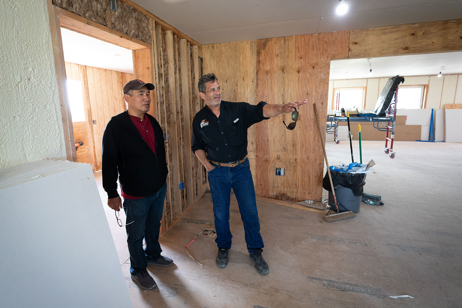 Russ Richardson, site superintendent, shows Pastor Don Cross some of the winter-worthy features of the new building in the weeks leading up to its completion.