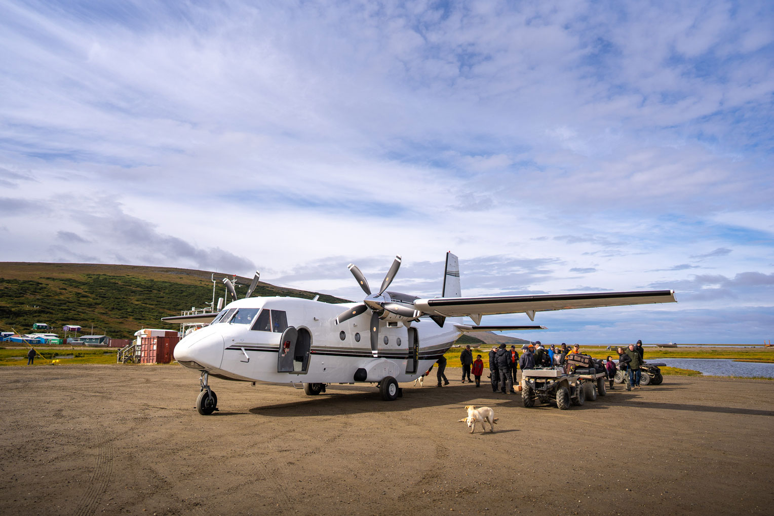 Teams unload materials from our CASA aircraft at one of the remote villages.