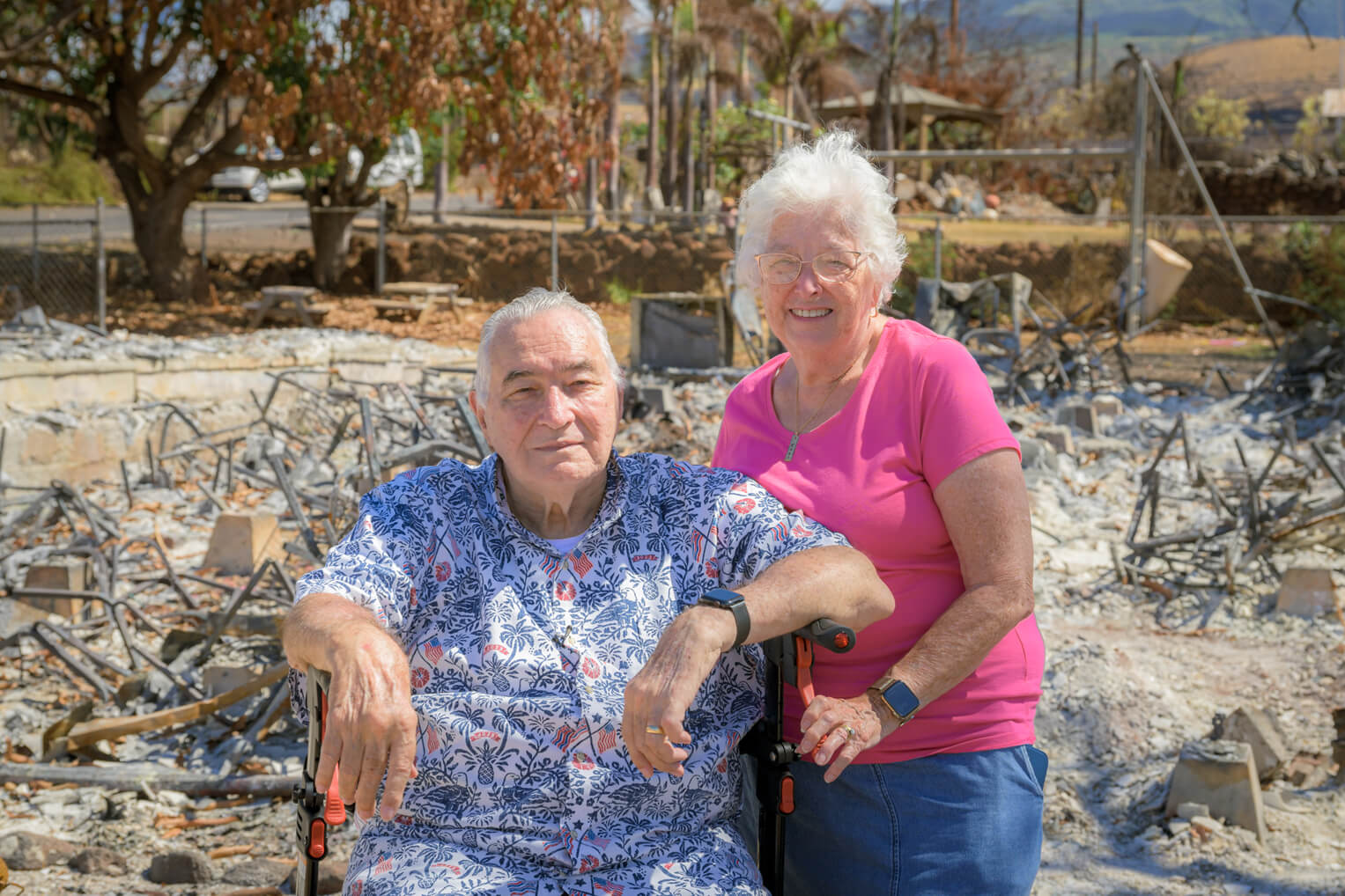 Pastor Arza and Ruth Brown at their church site, which was burned to the ground by the summer's fires. 