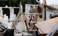 A man looks aghast at the ruins of a home attacked in Ashkelon, Israel, on Oct. 7.
