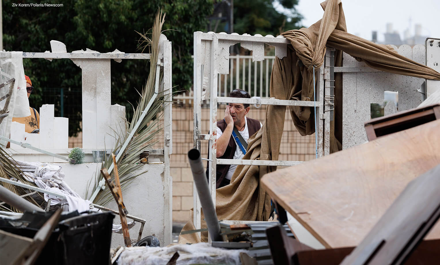 A man looks aghast at the ruins of a home attacked in Ashkelon, Israel, on Oct. 7.