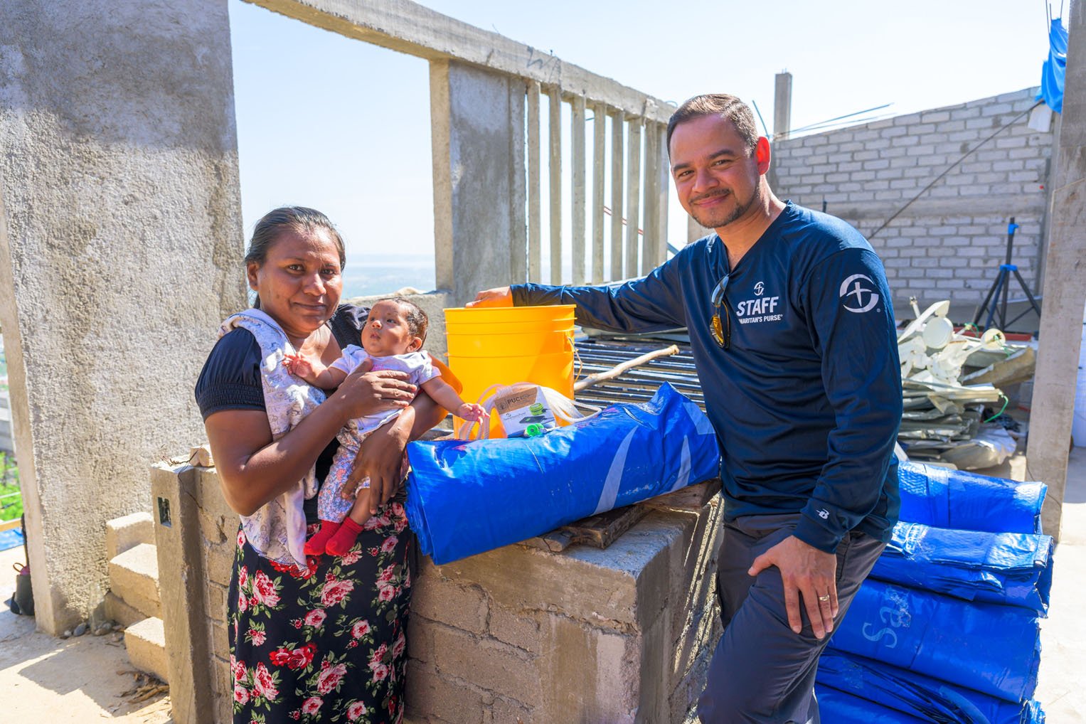 Angelica and her child were one of hundreds of residents who received shelter supplies and water filtration systems for their homes.