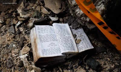 Devotional book in Hebrew lying in ruins