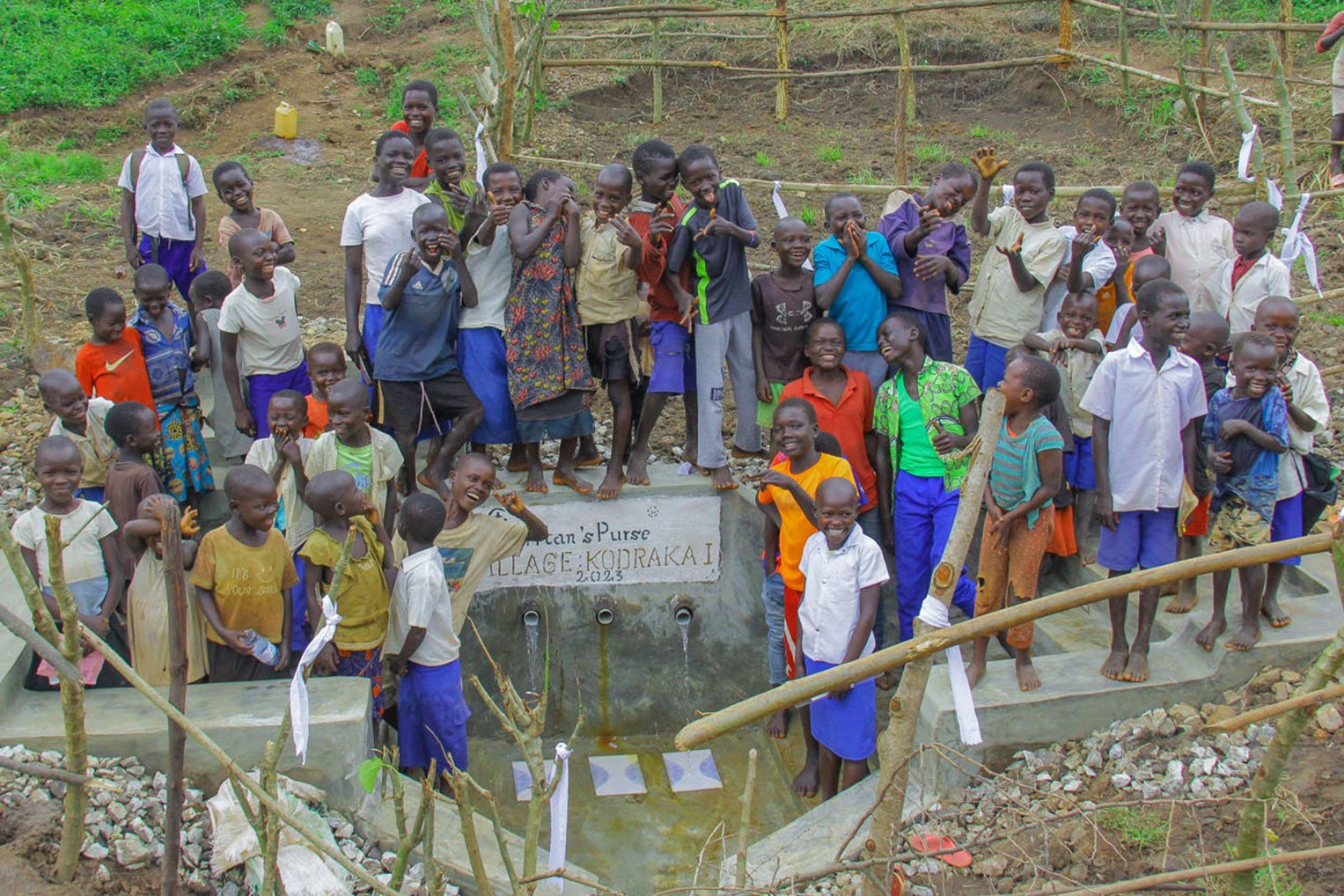 The village children enjoyed tasting the clean water coming out of the water point constructed by Samaritan's Purse.