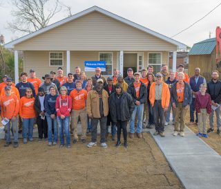 Our rebuild team celebrated Lewis Sharpe's new home provided by Samaritan's Purse.