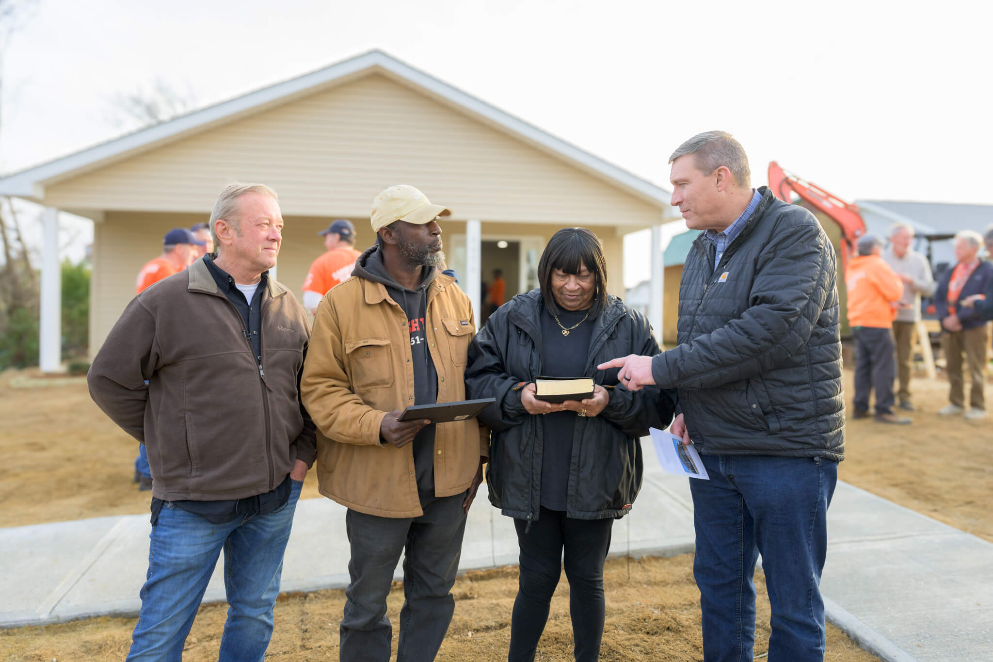 Luther Harrison, vice president of North American Ministries at Samaritan's Purse, encourages Lewis and his wife to enjoy the riches of Scripture.