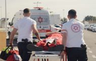 Two Israeli medics guide a gurney toward one of the new ambulances provided by Samaritan's Purse in Jerusalem.