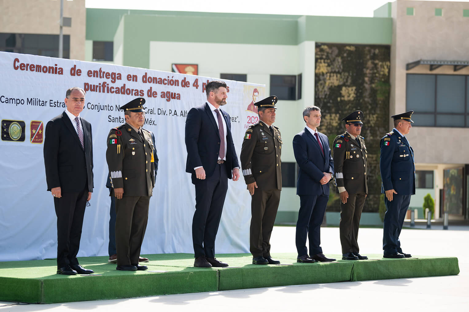 Edward Graham, chief operating officer, and Dave Philips, deputy director of international projects, stand with Mexican leaders at the recent handover ceremony.