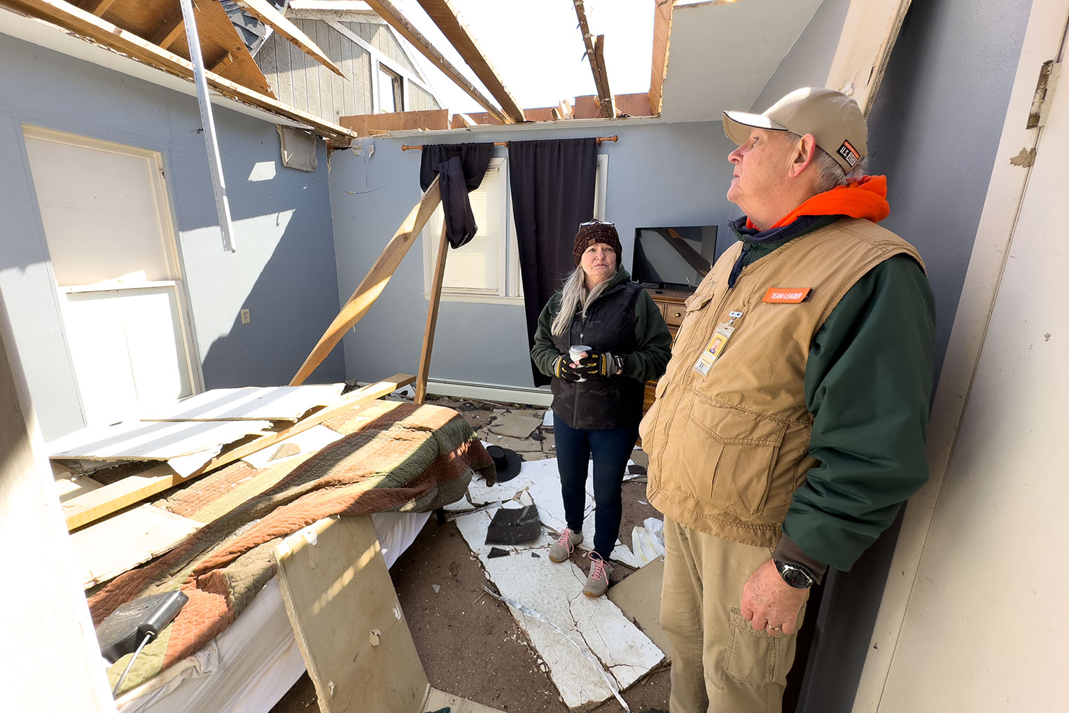 Jenny Leiter shows one of our Site Leadership Team the room where she hid as the tornado past over.