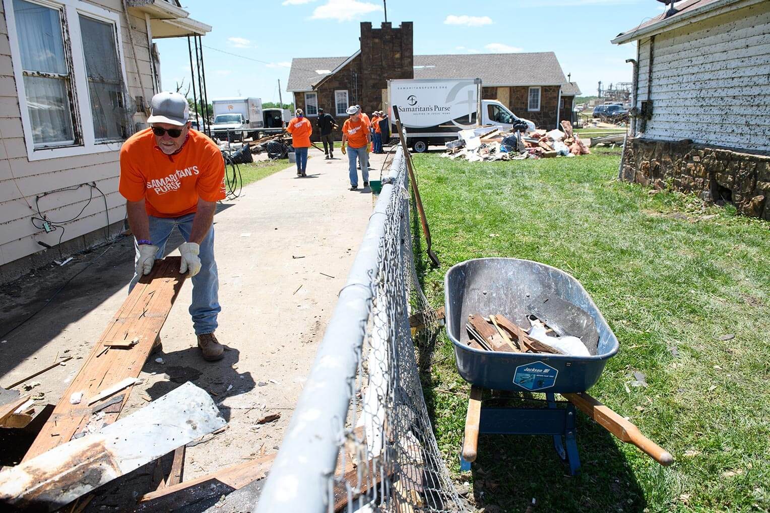 Our volunteers remove debris left by the powerful twister.