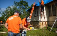 volunteers working on a roof and on the ground in Oklahoma