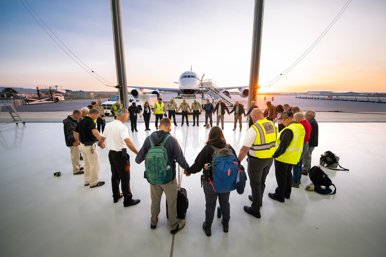 Ground and flight crews joined in prayer with relief teams.
