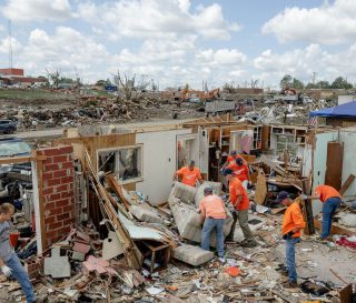 Volunteers helped Greenfield homeowners clean up and salvage valuables after an EF-4 tornado.