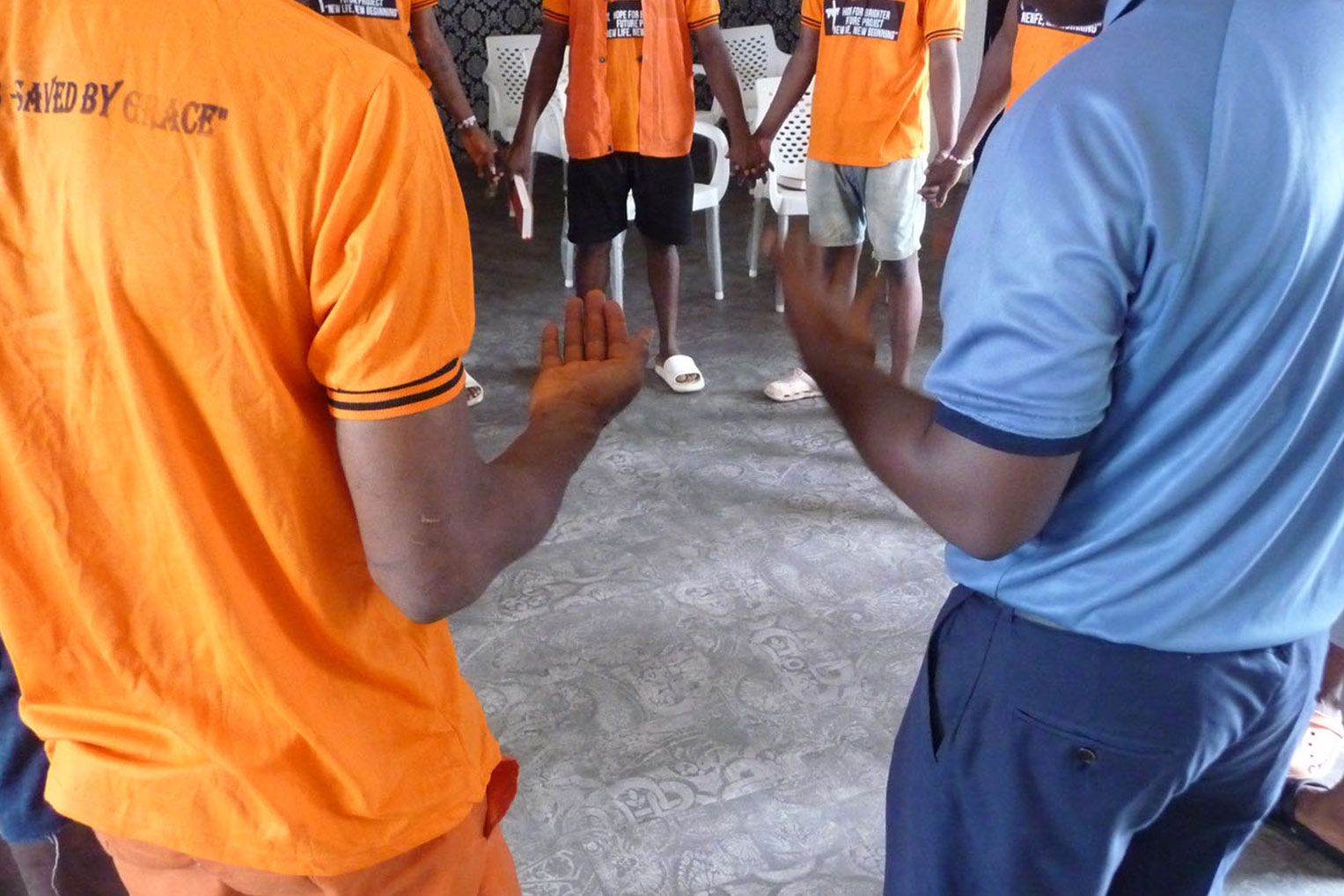 Inmates gather for prayer each week during the class, where they are learning how to follow Jesus Christ no matter where they are.