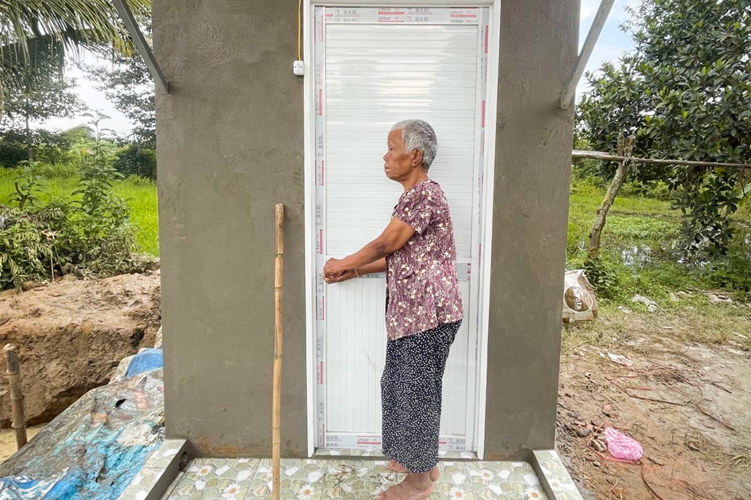 Thia will no longer need to limp to an unsanitary, distant latrine after Samaritan's Purse built a bathroom and shower on her property.