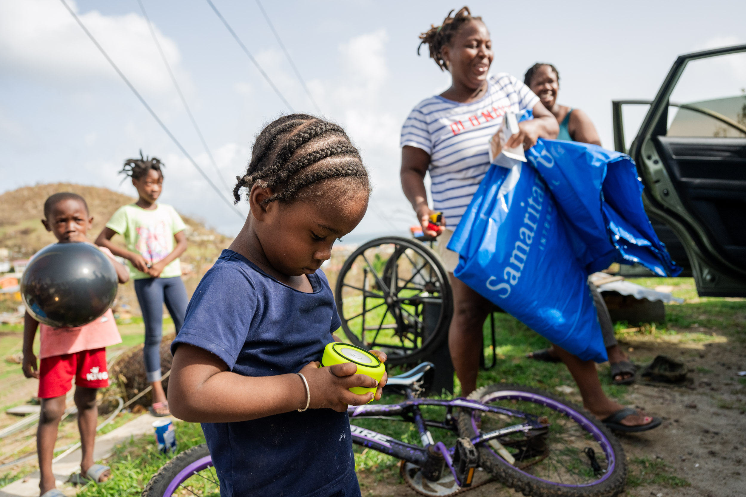 A child learns how to operate his family's solar-powered light.