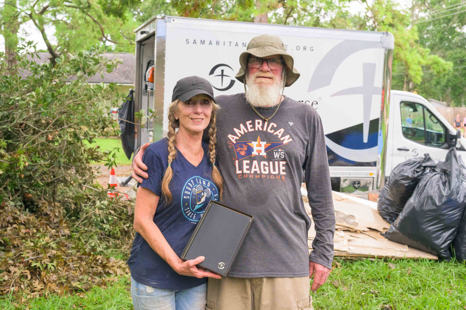 The Burches received a special Billy Graham study Bible, signed by each volunteer, after the work on their house was completed.