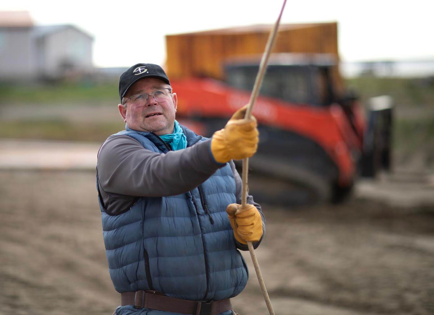 Brent Baumann of Great Falls, Montana, wrangles a truss onto the new church roof.