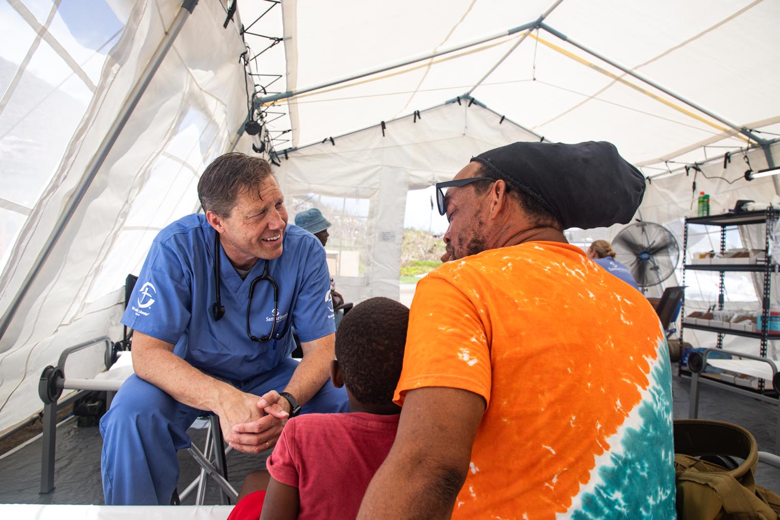 Dr. Chris Brandenburg cares for Aistan's son who came in with a severe allergic reaction--most likely from the difficult conditions they've been living in since the storm.